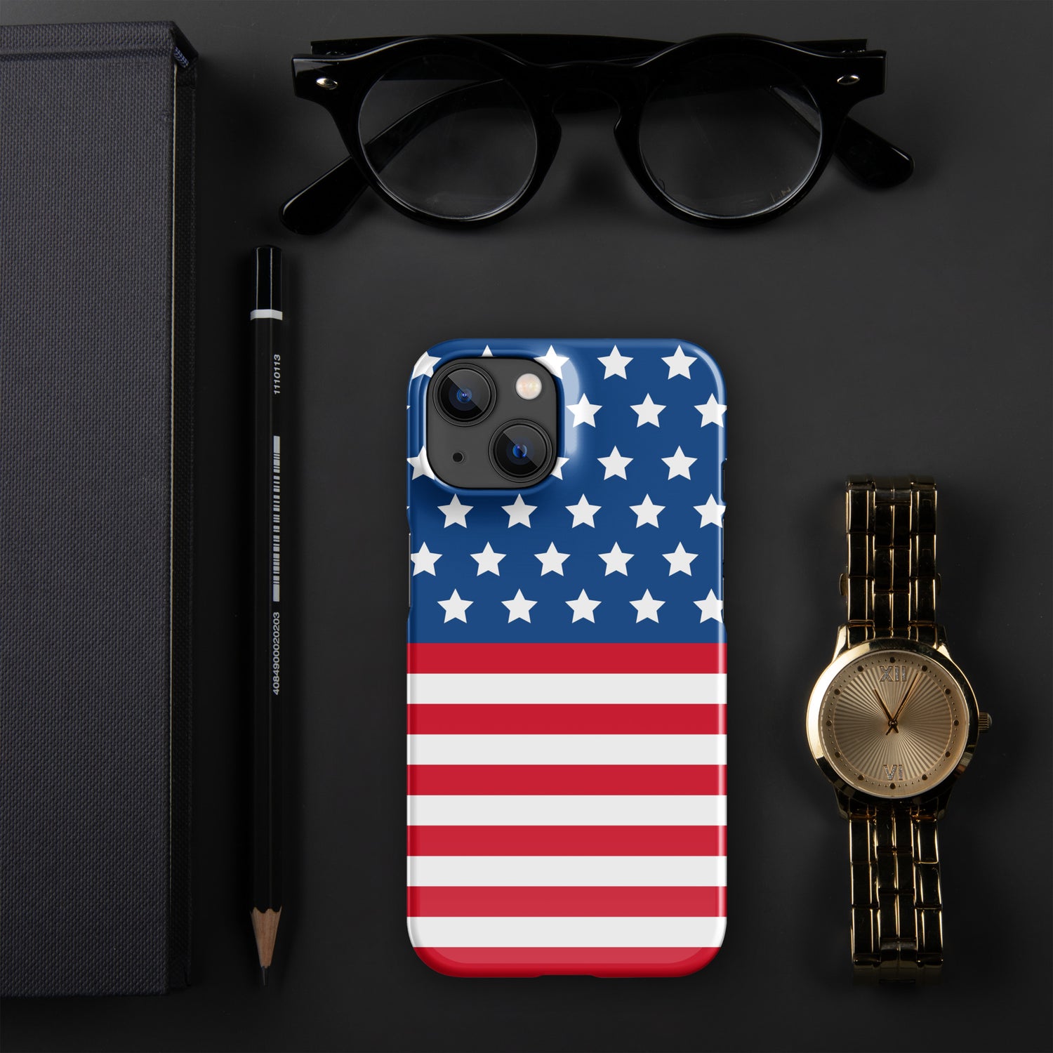 An iPhone case laying on a desk. The iPhone case has the USA Flag design on it.