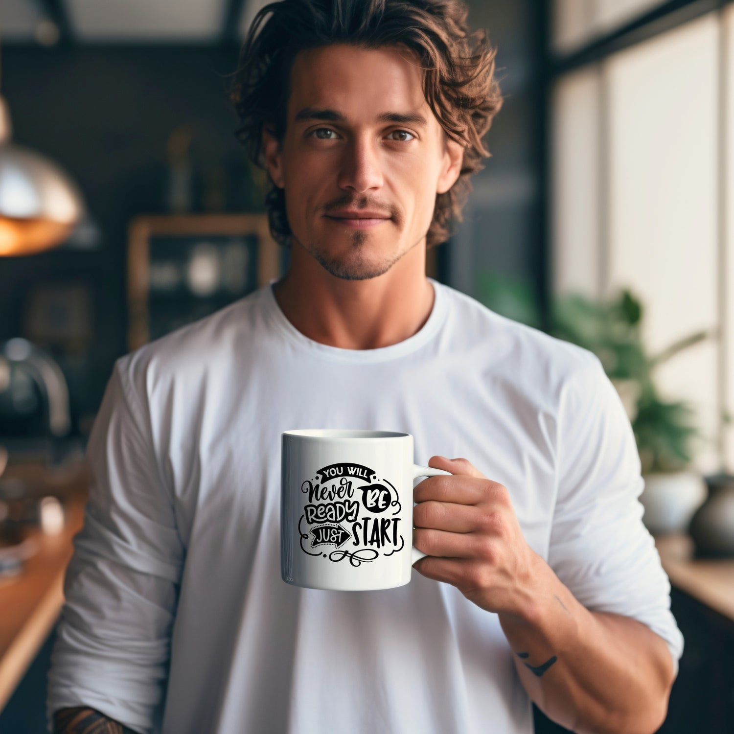 A nice guy holding a white mug. The mug has the design and the saying “You will never be ready, just start”.